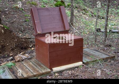 An open air privy at a primitive campsite in the Adirondack Mountains, NY USA wilderness. Stock Photo