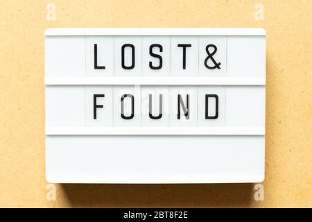 Lightbox with word lost & found on wood background Stock Photo