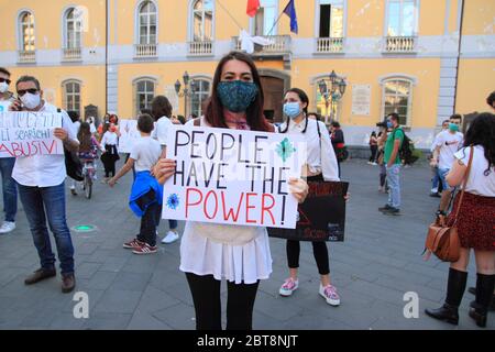 A woman shows her protest cartel to the flash mob organized for the protection of the river Sarno in southern Italy . Stock Photo