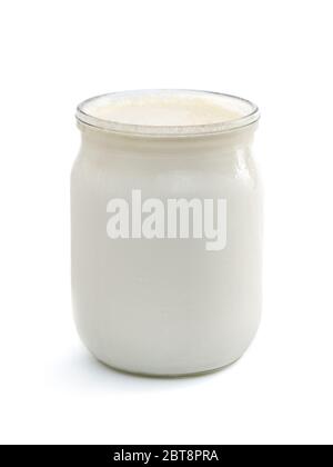 Georgian matsoni yoghurt in a glass pot isolated on white background Stock Photo