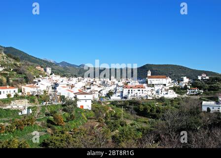 View of whitewashed village (pueblo blanco) and surrounding countryside, Sedella, Spain. Stock Photo