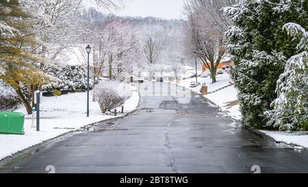 A landscape of a residential community seen covered with snow during winter Stock Photo