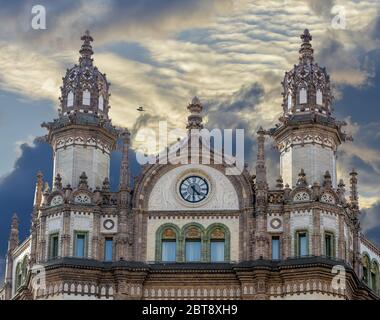 The Art Nouveau style Brudern House's (also named Paris Courtyard)  ceramic-clad facade with two ornate domes and a clock tower.Downtown of Budapest,Hu Stock Photo
