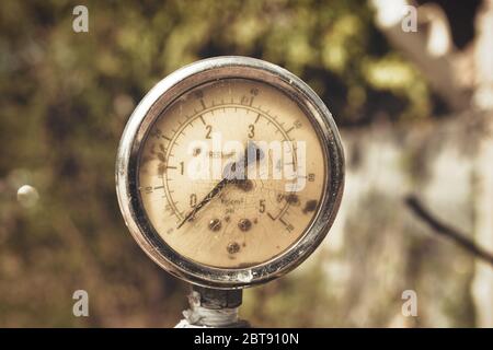This unique photo shows an old pressure gauge weathered by the tide on a fire hydrant. The picture was taken in Thailand Stock Photo