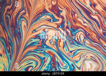 Abstract rainbow pattern created by reflecting light of a film of soap Stock Photo