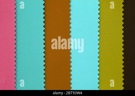 Multi pastel color fabric texture samples. Samples of fabrics of different colors retro style. Polyester texture, pieces of fabric with scarred edges Stock Photo