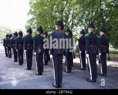 Norwegian soldiers in gala uniforms near royal palace in european capital city of Oslo at Ostlandet district in Norway, clear blue sky in 2019 warm su Stock Photo