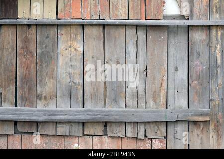 Old wooden boards of different sizes top view, Beautiful background for design. Fence in the village from wooden boards with sunburned paint. The text Stock Photo