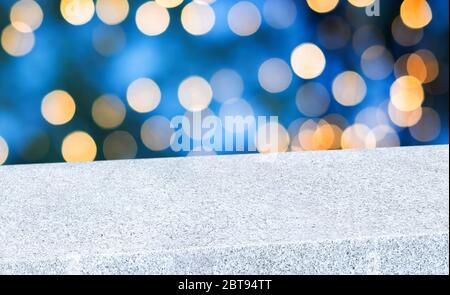 Empty diagonal stone table with blur night lights in blue sky bokeh background,banner mockup template for display of product Stock Photo