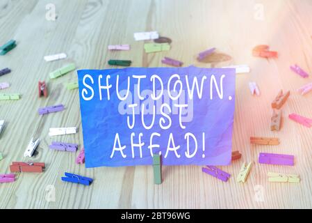 Writing note showing Shutdown Just Ahead. Business concept for closing factory business either short time or forever Stock Photo