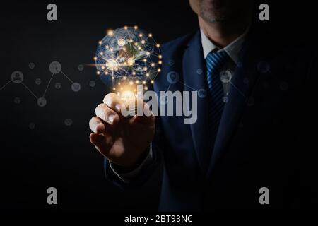 Innovation and idea of professional leader holding lighting bulb,thinking management concept Stock Photo