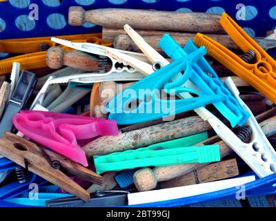 Sutton in Ashfield, Nottinghamshire, UK. July 23, 2010. Variety of plastic and wooden clothes pegs in the peg basket ready to peg washing to dry at Su Stock Photo