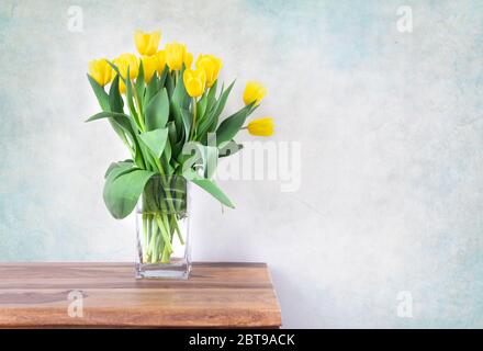 yellow tulips bouquet in vase Stock Photo