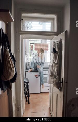 Environmental portrait of a female artist in her basement apartment in Prague Stock Photo