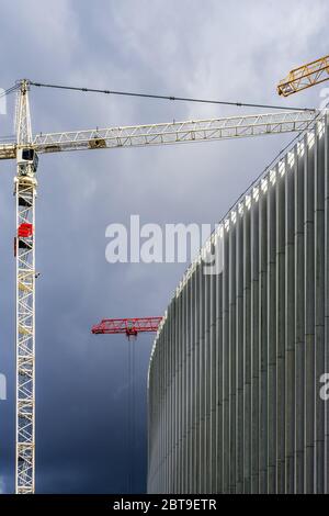 Tower cranes at modern construction site in city centre, Rue Ravenstein, Brussels, Belgium. Stock Photo
