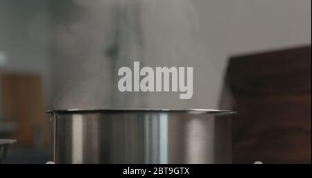 steam rising from saucepan closeup Stock Photo