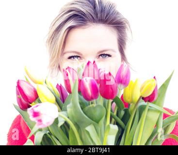 dutch flowers tulips beautiful woman behind flowers Stock Photo