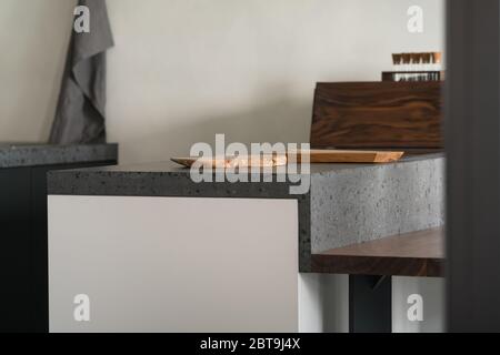 Contemporary White Kitchen with Concrete Countertop, Pull-Out Cutting Board  Stock Photo - Alamy