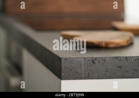 Modern minimalistic kitchen interior with concrete terrazzo countertop Stock Photo