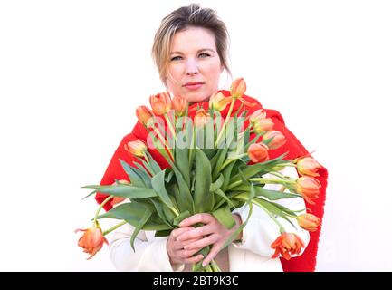 dutch flowers tulips beautiful woman behind flowers Stock Photo