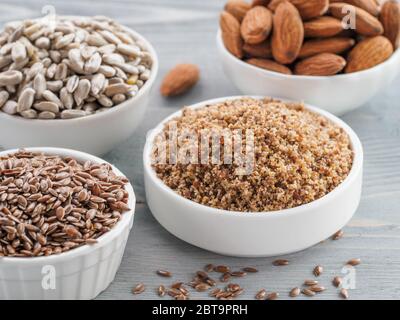Homemade LSA mix in plate and Linseed or flax seeds, Sunflower seeds and Almonds. Traditional Australian blend of ground, source of dietary fiber, protein, omega fatty acids. Copy space for text. Stock Photo