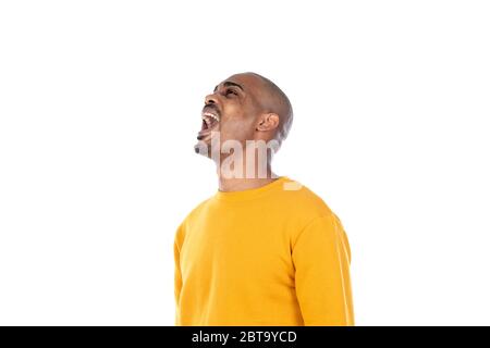 Afroamerican guy wearing a yellow jersey isolated on a white background Stock Photo