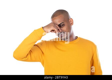 Afroamerican guy wearing a yellow jersey isolated on a white background Stock Photo