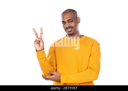 Afroamerican guy wearing a yellow jersey isolated on a white background Stock Photo