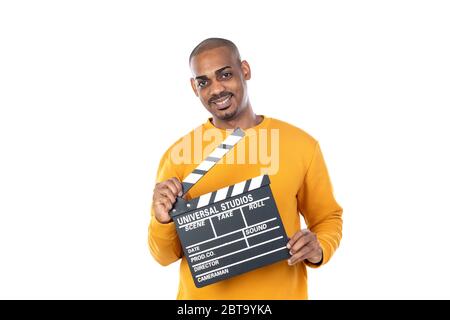 African guy with yellow T-shirt isolated on a white background Stock Photo