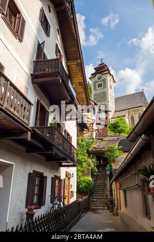 Entrance to the 'Bedeckte Stiege', a public stairway leading to the Catholic Parish Church which is covered with wooden shingles - Hallstatt, Austria Stock Photo