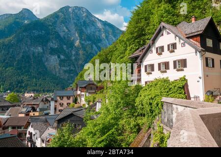 Traditional old house built high above the mountain village Hallstatt in the Salzkammergut region, OÖ, Austria, overlooking the town Stock Photo