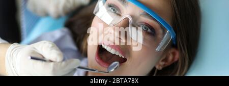 Girl feels comfortable at dental examination. Stock Photo