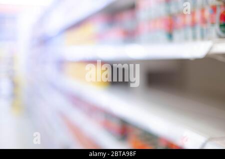 Abstract blurred effect Empty Food Shelves in a Supermarket due to people panicking and hoarding groceries, CoronaVirus Outbreak. Coronavirus Covid-19 Stock Photo