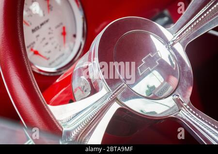 TORONTO, CANADA - 08 18 2018: Crome steering wheel with Chevrolet cross logo of red Chevrolet Thriftmaster pikup truck oldtimer car on display at the Stock Photo