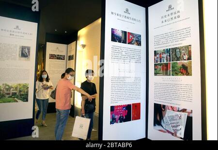 Shanghai, China. 24th May, 2020. Tourists visit an open air museum at the Sinan Mansions in Shanghai, east China, May 24, 2020. A night fair of Sinan Mansions with food stalls, open air museum and art exhibitions etc., opened to boost Shanghai's nighttime economy. Credit: Chen Fei/Xinhua/Alamy Live News Stock Photo