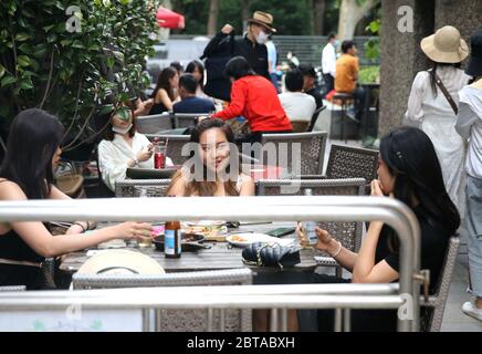 Shanghai, China. 24th May, 2020. Tourists are seen at a night fair of Sinan Mansions in Shanghai, east China, May 24, 2020. A night fair of Sinan Mansions with food stalls, open air museum and art exhibitions etc., opened to boost Shanghai's nighttime economy. Credit: Chen Fei/Xinhua/Alamy Live News Stock Photo