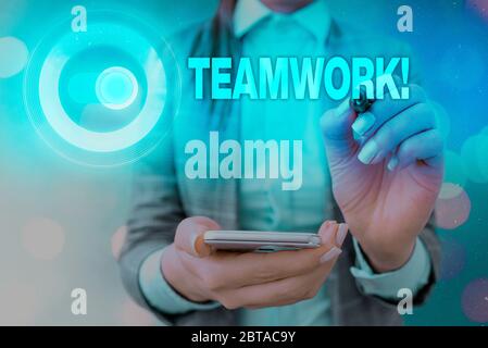 Handwriting text writing Teamwork. Conceptual photo combined action of group especially when effective and efficient Stock Photo