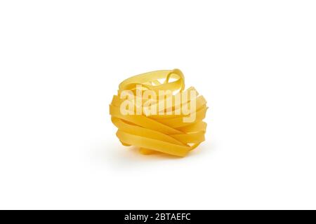 Italian raw dry pasta fettuccine isolated on white background Stock Photo