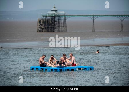 A group of young men enjoy the sunshine in Clevedon Marine Lake in Somerset after lockdown restrictions were eased in England last week. Stock Photo