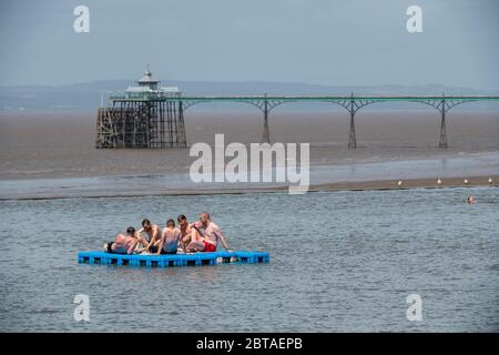 A group of young men enjoy the sunshine in Clevedon Marine Lake in Somerset after lockdown restrictions were eased in England last week. Stock Photo