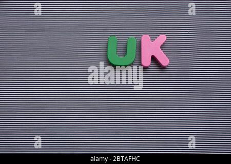 Abbreviation of united kingdom UK on wood background Stock Photo