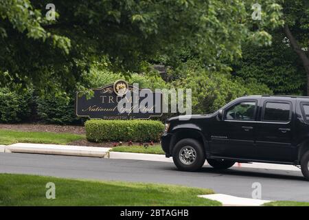 Washington, United States. 24th May, 2020. The motorcade ferrying President Donald Trump turns into the Trump National Golf Club in Sterling, Virginia, on Sunday, May 24, 2020. This is the second time in two days the president has visited his golf club near Washington, DC. He played golf on Saturday, the first time since the lockdown over the coronavirus COVID-19 pandemic. Nearly 100,000 Americans have died due to the novel virus. Photo by Jim Lo Scalzo/UPI Credit: UPI/Alamy Live News Stock Photo