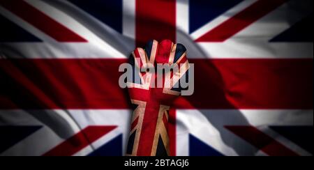 Banner of Flag of United Kingdom painted on male fist, fist flag, country of UK, strength, power, concept of conflict. On a blurred background with a Stock Photo