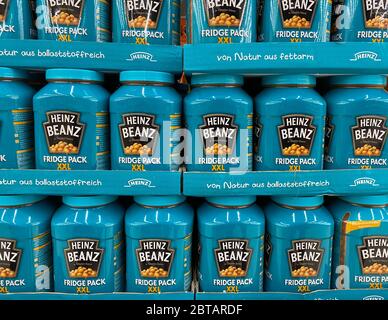 Tönisvorst, Germany - May 22. 2020: Close up of isolated Heinz baked beans packs stacked in a shelf Stock Photo