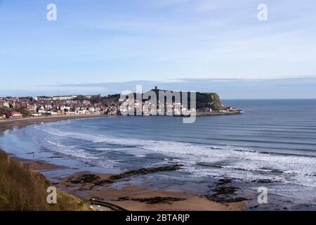 A sunny spring morning highlights the Old Town of Scarborough and the shelter that the Castle Headland offered to the early Viking settlers Stock Photo