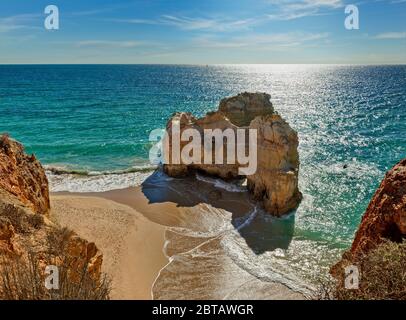 Rock formation on an empty beach, Praia da Rocha, the Algarve, Portugal Stock Photo