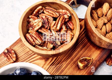 Peeled pecan nuts isolated on white background Stock Photo