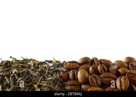 Pile of coffee beans and dry green tea leaves isolated on white background. closeup, copy space for your text Stock Photo