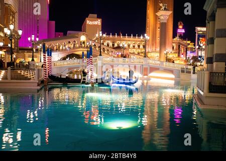 LAS VEGAS, NEVADA - FEBRUARY 23, 2020:  View of Venetian Resort in Las Vegas seen at night with lights illuminated and Grand Canal Stock Photo