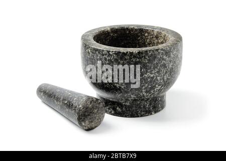 Stone mortar for grinding ingredients isolated on a white background Stock Photo